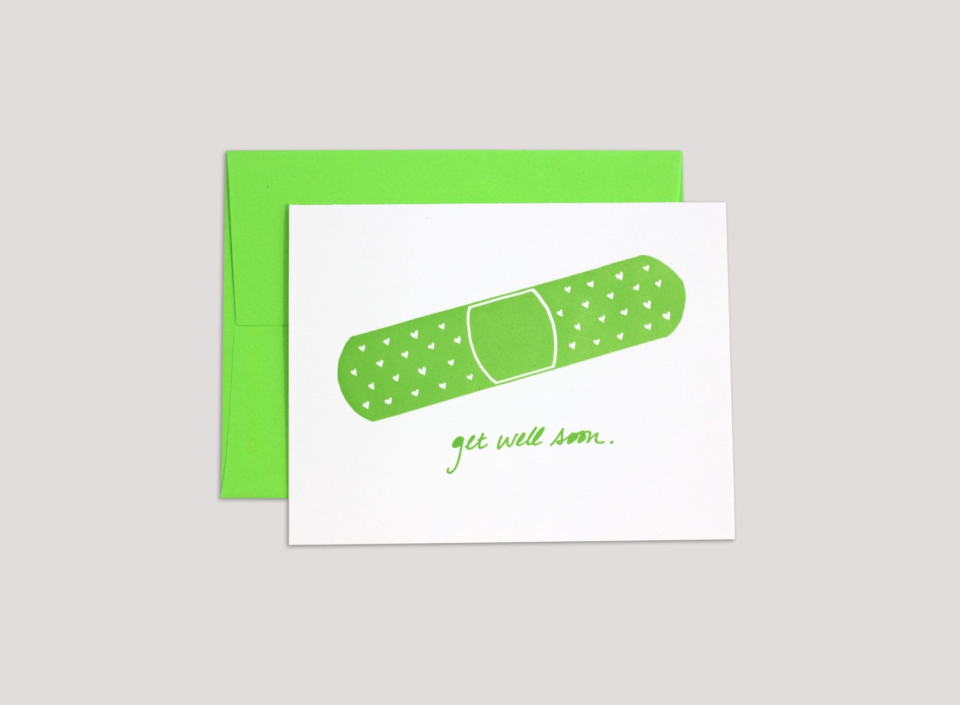 greeting card with a band-aid illustration and the lettering "get well soon"